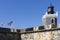 Lighthouse and flags on Castillo San Felipe del Morro.