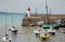 Lighthouse harbor and boats