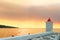 Lighthouse in the harbor of town Postira shot at sunset - Croatia, island Brac