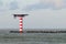 Lighthouse with heliplatform at the North Sea near the entrance of the Port of Rotterdam