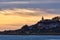 Lighthouse illuminated at sunrise on the cape. Cabo de las Huertas  Alicante. Spain