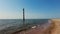 Lighthouse inside the water, sea. Lighthouse along the shoreline, leaning inside