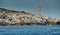 The lighthouse on the island in Croatia nearby Vis at sunset, a rocky coast, ladder to a beacon, a small cape