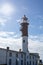 Lighthouse on the island of Poel on the Baltic Sea with sun