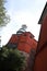 Lighthouse of the Isola del Tino, in the Gulf of La Spezia,  Near Cinque Terre. Red painted building and white tower with glass