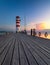 Lighthouse at Lake Neusiedl, Podersdorf am See, Burgenland, Austria. Lighthouse at sunset in Austria. Wooden pier with lighthouse