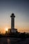 Lighthouse of Lastres at sunset captured in the town of Luces, Spain