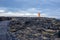 Lighthouse in lava field in beautiful nature in Snaefellsjokull National Park in Iceland, autumntime