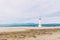 Lighthouse on the lonely beach of delta del ebro, tarragona, spain