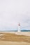 Lighthouse on the lonely beach of delta del ebro, tarragona, spain