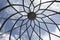 Lighthouse metallic and glass dome structure detail under blue sky