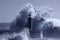 Lighthouse in the middle of stormy waves