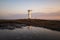 Lighthouse in the morning on the Baltic Sea with windmill wings in Swinoujscie, Poland