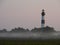 Lighthouse in the morning mist