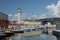 Lighthouse, motor boats in harbor in Trieste, Italy