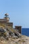 Lighthouse near the city Monemvasia against the background of the sea and sky Greece, Peloponnese