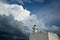 A lighthouse on an old building in Telchac Puerto on the coast of YucatÃ¡n on the Gulf of Mexico, cormorants sitting on the roof