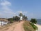 Lighthouse and palm trees in the town of Galle, Sri Lanka. Galle - the largest city and port in the south of Sri Lanka, the