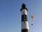 Lighthouse and a paraglider in Miraflores, Lima