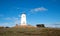 Lighthouse at Piedras Blancas point under sunset clouds on the Central Coast of California