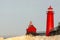 The lighthouse and pier at Grand Haven, Michigan, on Lake Michigan, bathed in warm morning sunlight