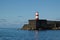 A lighthouse on a pier in Ponta Delgada
