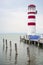 Lighthouse in Podersdorf in Austria on Neusiedler See lake with a port