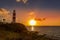 The Lighthouse of Pointe aux Caves Albion at sunset.