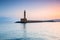 Lighthouse in the port of Chania at sunrise on Crete, Greece