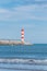 Lighthouse of Port-La-Nouvelle in red and white on cloudy sky