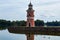 Lighthouse in a public park in Moritzburg / Saxony with a family of ducks in the foreground