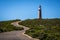 Lighthouse with red top and winding road at Cape du Couedic on Kangaroo island in Australia