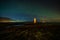 Lighthouse on Reykjanes peninsula under nortern lights. Iceland. Timelapse