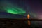 Lighthouse on Reykjanes peninsula under nortern lights. Iceland. Timelapse