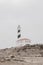 Lighthouse on rocks. Creative, minimal, bright and airy styled concept