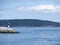 Lighthouse on the rocks on a sunny day