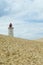 Lighthouse Rubjerg Knude and sand dunes at the danish North Sea