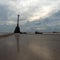 Lighthouse ruins. Wild sandy beach on the Baltic coast in December. Vidzeme rocky seashore