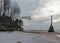 Lighthouse ruins. Wild sandy beach on the Baltic coast in December. Vidzeme rocky seashore