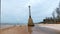 Lighthouse ruins. Wild sandy beach on the Baltic coast in December. Vidzeme rocky seashore