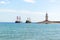 Lighthouse and sail ships in the Mediterranean sea