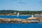 Lighthouse and sailboat on the archipelago island MerdÃ¸ in Norway