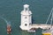 Lighthouse on San Giorgio Maggiore and motorboat, Venice, Italy