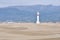 Lighthouse and sand dunes in Punta del Fangar (Spain)