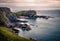 Lighthouse on a sea coastline cliff during sunset - North-West Scotland