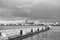 Lighthouse on sea pier in reykjavik iceland. Lighthouse yellow bright tower at sea shore. Seascape and skyline with