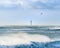 Lighthouse in the sea during windstorm with seagulls flight