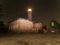 Lighthouse searchlight beam through dark night. Lighthouse at Darsser Ort near Prerow,