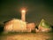 Lighthouse searchlight beam through dark night. Lighthouse at Darsser Ort near Prerow,