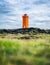 Lighthouse on the seashore in the Iceland. Icelandic landscape in the summer time. Famous place.